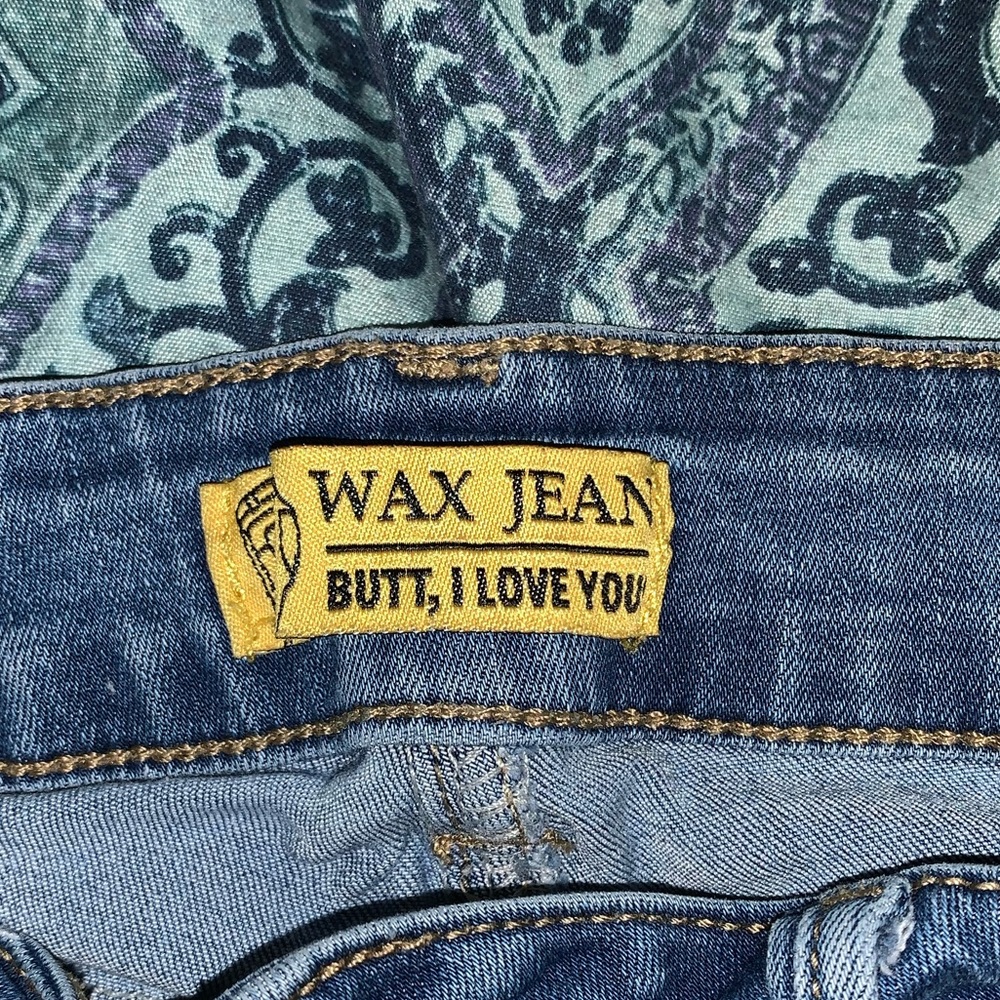 light blue, small, high waisted Jean shorts.
